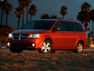 A Red Dodge Grand Caravan parked on the beach