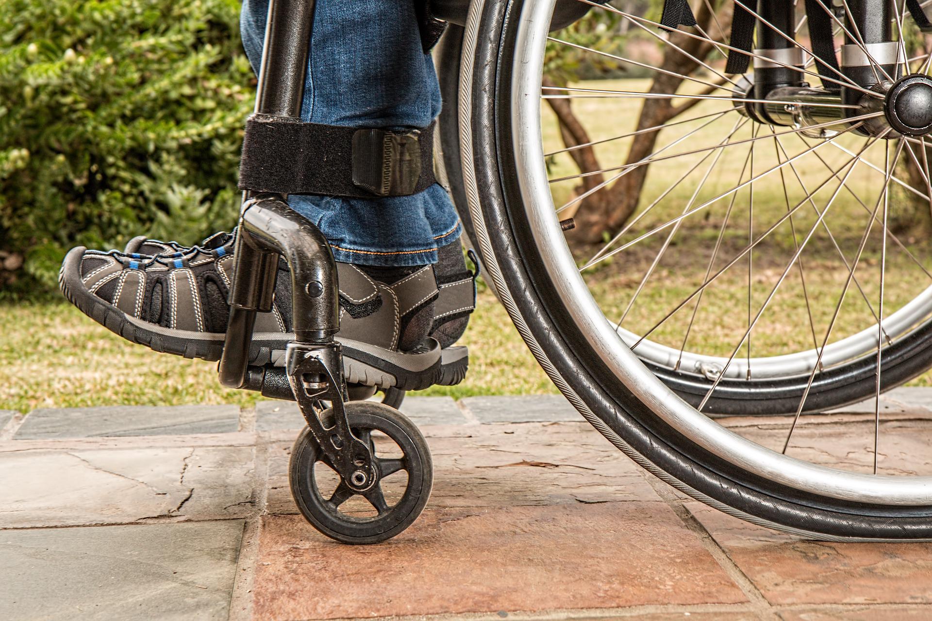 A person's feet on a wheelchair